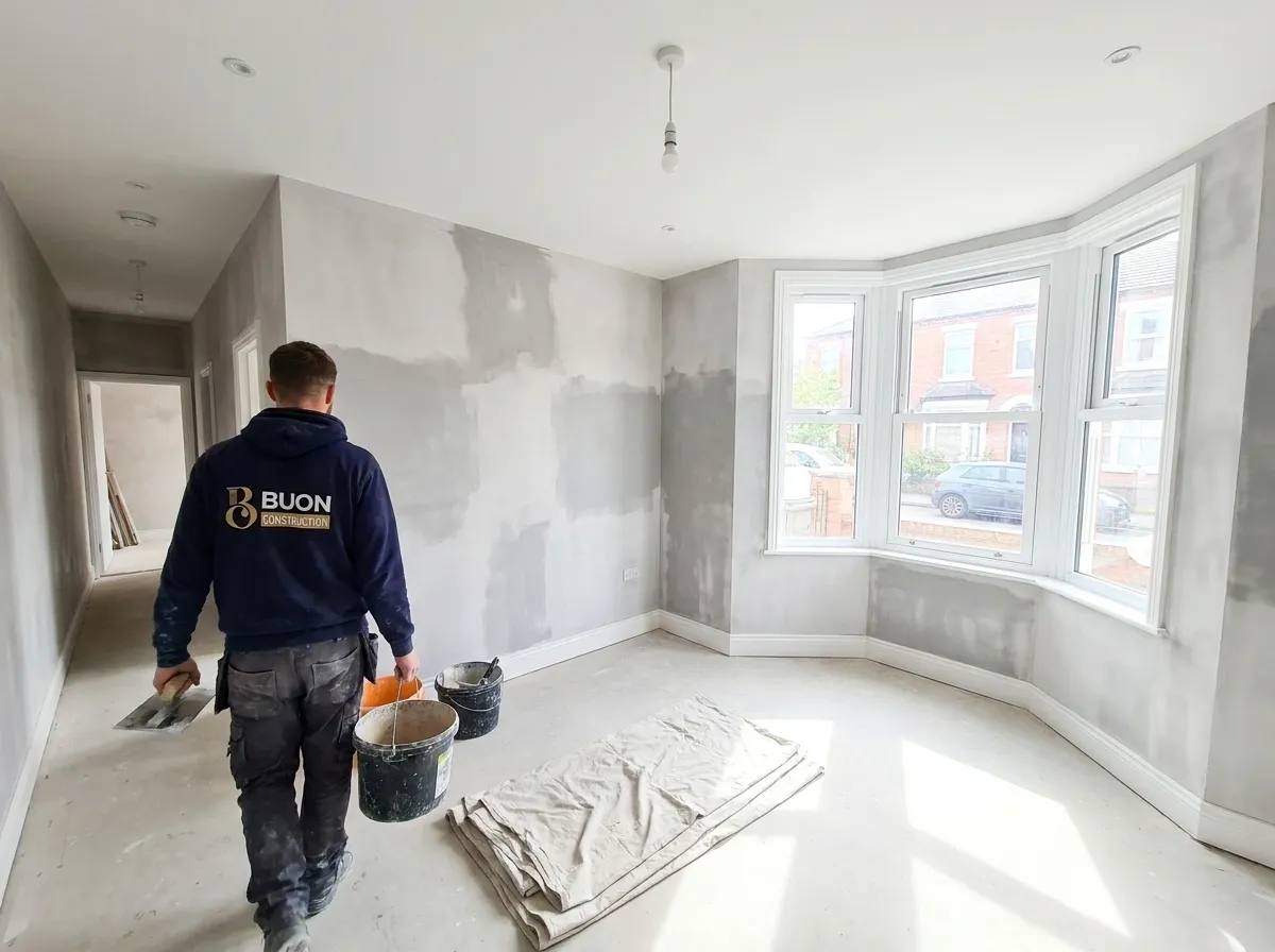 Plasterer with tools finishing a room to a smooth surface in Nottingham